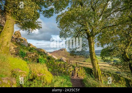 A Hen Cloud ramble view through moss covered stone gate at The Roaches in Peak District, UK Stock Photo