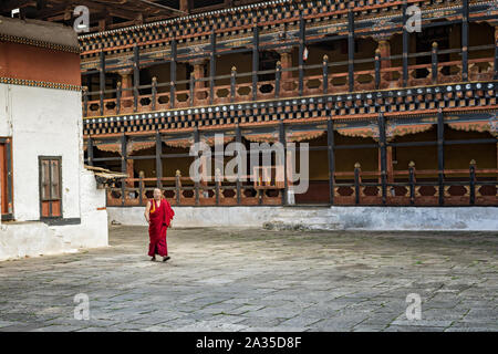 Monk in the courtyard of the Paro dzong (Rinpung Dzong), Bhutan Stock Photo