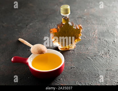 Maple Canadian syrup in a glass bottle. Stock Photo