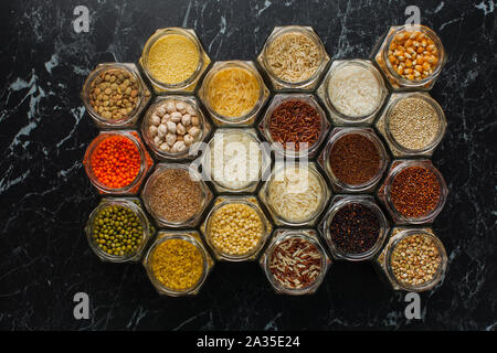 Top view of hexagon jars with cereals and beans Stock Photo