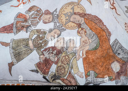 the three holy kings bring gold, frankincense and myrrh to Jesus, a wall-painting from about the year 1500 in the church of St. Mary, Elsinore, Denmar Stock Photo