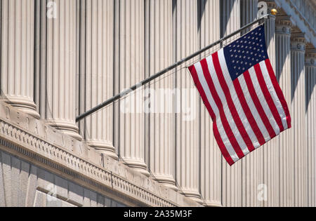 Stars and Stripes US Flag on the Department of Commerce Building, Constitution Avenue, Washington DC, USA Stock Photo