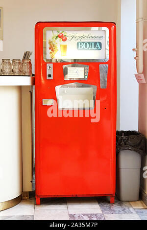 MOSCOW, RUSSIA - JUNE 05, 2013: Red soda vending machine in cafe in GUM (State Department Store). Such machines were popular in Soviet times Stock Photo