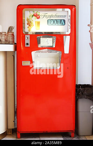 MOSCOW, RUSSIA - JUNE 05, 2013: Red soda vending machine in cafe in GUM (State Department Store). Such machines were popular in Soviet times Stock Photo