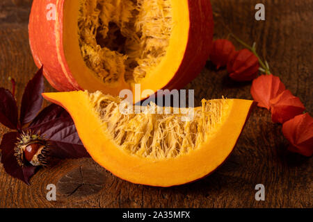 sliced hokkaido pumpkin on wood Stock Photo
