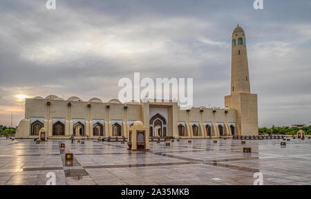 Imam Muhammad ibn Abd al-Wahhab Mosque (Qatar State Mosque) exterior view at sunset with clouds in the sky Stock Photo