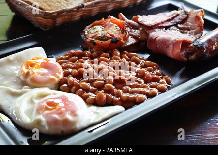Traditional English breakfast served on contemporary modern plate Stock Photo
