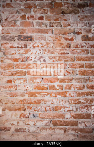 Red brick wall. Red bricks stacked make up the wall. Plaster parts. construction site Stock Photo
