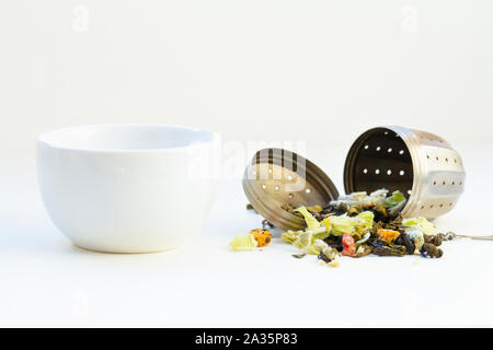 loose herbal tea in tea strainer Stock Photo