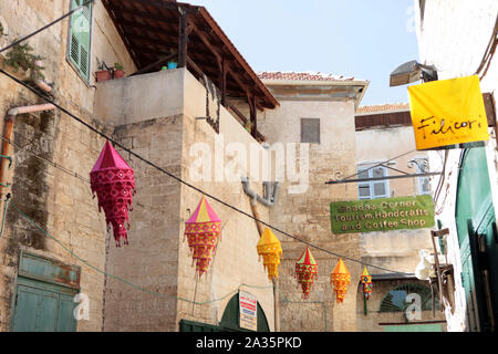 Nazareth, ISRAEL - 10 May 2019: Narrow street with colorful lanterns decorations in old town in Nazareth Stock Photo