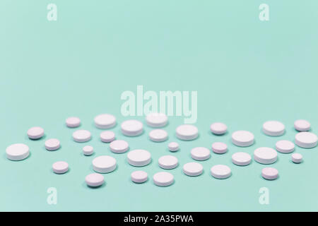 White pill on a purple background with copy space. Stock Photo