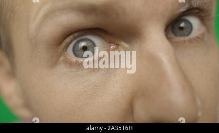 Close-up of a surprised emotional man with blue eyes looking into the camera. Stock Photo