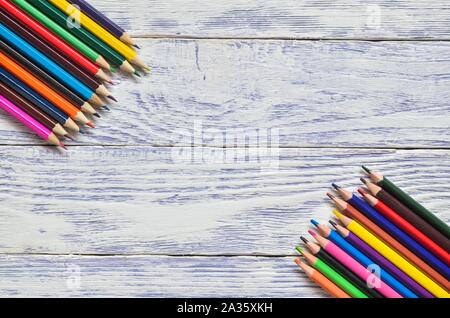 Creative concept with school supplies. Frame with school accessories  on a wooden background. Stock Photo