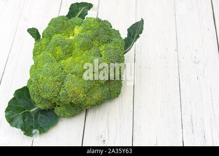 Broccoli cabbage on white wood background background. Copy space. Stock Photo