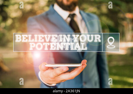 Handwriting text writing Believe In Your Potential. Conceptual photo Have selfconfidence motiavate inspire yourself Businessman in blue suite stands w Stock Photo