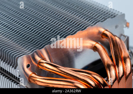 modern tower heat radiator with six copper heatpipes closeup macro background with selective focus, blur and diagonal composition Stock Photo