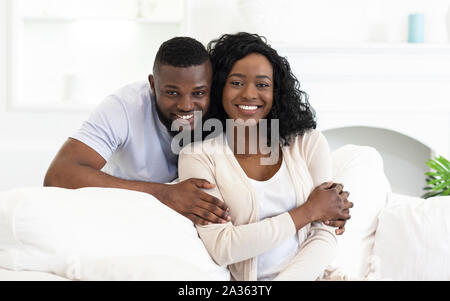 African american family sitting at home posing to camera Stock Photo