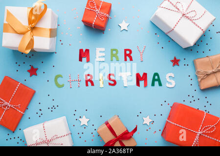 Different presents in boxes on blue winter background Stock Photo