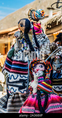 Sacred Valley, Peru - 05/21/2019: Colorful dolls outside a shop in Ollantaytambo, Peru in the Sacred Valley. Stock Photo