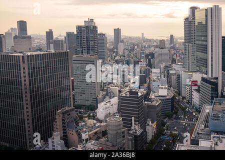 Osaka, Japan - September 22, 2019: Orange sunset over business towers and sprawling downtown Umeda district Stock Photo