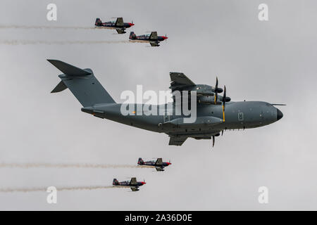 Airbus A400M Atlas in a formation flypast with The Blades aerobatic display team at RIAT 2019, RAF Fairford, UK on the 21st July 2019. Stock Photo