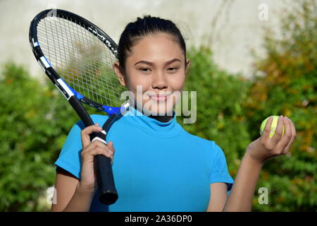 Asian Girl Tennis Player And Happiness With Tennis Racket Stock Photo