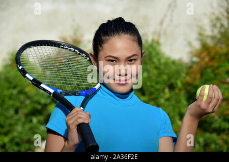 Sporty Diverse Female Tennis Player And Happiness With Tennis Racket Stock Photo