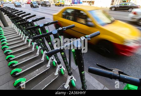 Bucharest, Romania - September 29, 2019: Several Lime-S electric scooters are parked on a sidewalk in Bucharest. This image is for editorial use only. Stock Photo