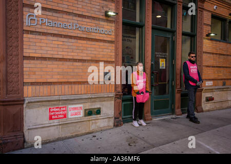 New York, USA. 5th Oct, 2019. Two volunteers standing at the door of the Planned Parenthood offices in SoHo. Credit: Erik McGregor/ZUMA Wire/Alamy Live News Stock Photo