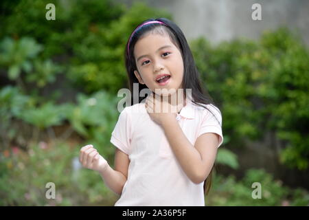Pretty Asian Juvenile With Sore Throat Stock Photo