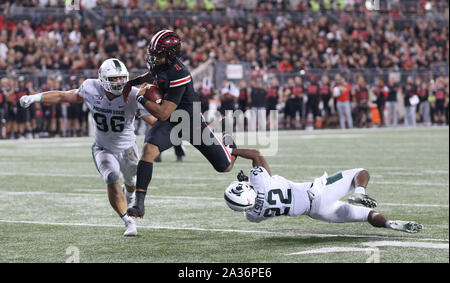 Columbus, United States. 06th Oct, 2019. Ohio State Buckeye's Justin Fields (1) is taken down by Michigan States Josiah Scott (22) and Jacub Panasiuk (96)Saturday, October 5, 2019 in Columbus, Ohio. Photo by Aaron Josefczyk/UPI Credit: UPI/Alamy Live News Stock Photo