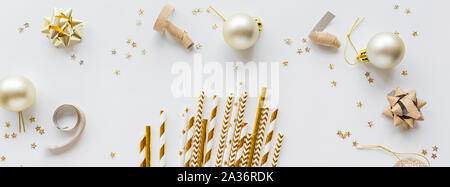 New Year or Christmas pattern flat lay top view 2020 Xmas holiday celebration drinking cocktail party paper straws on white background. Horizontal Stock Photo