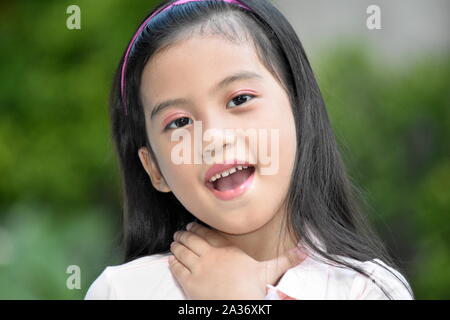 Youthful Minority Girl With Sore Throat Stock Photo