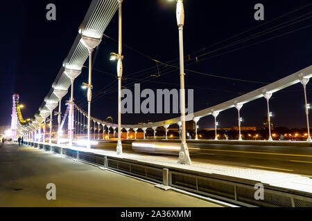 Krymsky Bridge or Crimean bridge in Moscow, Russia night view with white illumination, suspension steel bridge over the Moscow River evening time city Stock Photo
