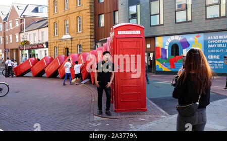 Kingston Upon Thames South West London UK - Out of Order by David Mach red telephone box sculpture  Photograph taken by Simon Dack Stock Photo