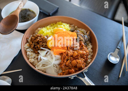 Albap- Korean rice with Tobiko egg, is orange (flying fish roe) on Frying Pan Stock Photo