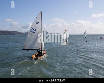 Lyme Regis, Dorset, UK. 6th October 2019. Sailing boats leave the harbour on a glorious sunny and warm morning in ideal autumn boating weather. Credit:  Julian Eales/Alamy Live News Stock Photo