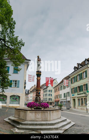 Delemont, Jura / Switzerland - 28 August, 2019: view of the historic 'Fontaine de la Vierge' or Fountain of the holy Virgin in the Swiss city of Delem Stock Photo