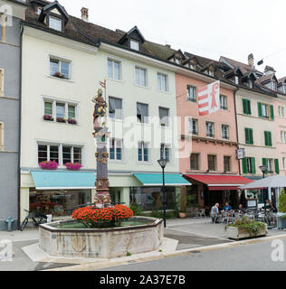 Delemont, Jura / Switzerland - 28 August, 2019: view of the historic 'Fountaine de Saint-Maurice' or Saint-Maurice fountain in the Swiss city of Delem Stock Photo