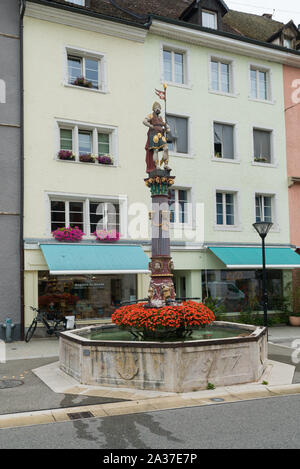 Delemont, Jura / Switzerland - 28 August, 2019: view of the historic 'Fountaine de Saint-Maurice' or Saint-Maurice fountain in the Swiss city of Delem Stock Photo