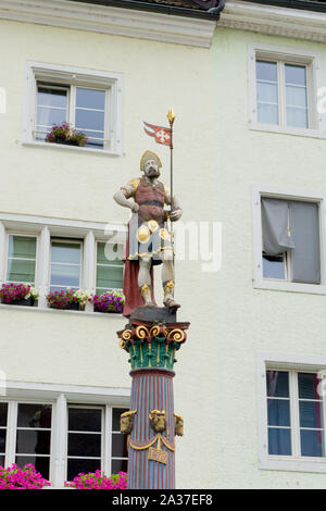 Delemont, Jura / Switzerland - 28 August, 2019: view of the historic 'Fountaine de Saint-Maurice' or Saint-Maurice fountain in the Swiss city of Delem Stock Photo