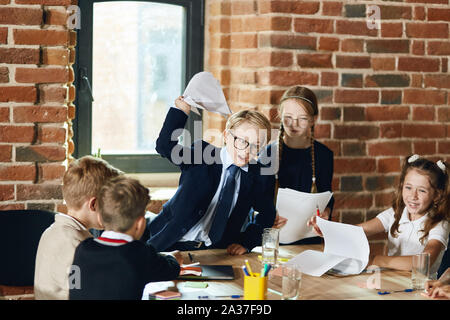 furious leader throwing the documants to his co-workers at office with loft interior. close up photo Stock Photo