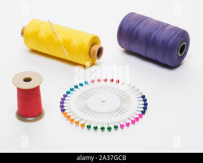 Blue thread. Set of sewing thread coils on white natural fabric with  embroidery. Several reels of thread in different shades of blue. Selective  focus Stock Photo - Alamy