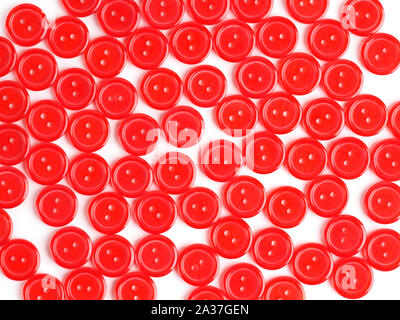Red plastic buttons on white background Stock Photo