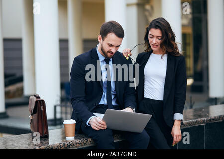 awesome couple thinking how to make money from business, close up photo Stock Photo
