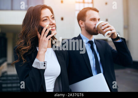 pleasant office workers having a rest after difficult working day, relaxation, weekend, holiday Stock Photo