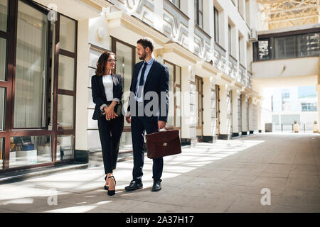 co-workers walking in the business city center.copy space. man consulting intern,trainee. internship Stock Photo