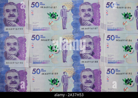 Currency of Colombia, several fifty thousand Colombian Peso paper currency banknotes, negotiable promissory notes Stock Photo