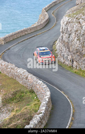 Llandudno, Wales, UK. 6th Oct 2019. Great Orme stage has been called off because rough weather conditions mean the team of divers required for safety reasons cannot get close enough to the stage, The cars drove a parade lap. Credit: Jason Richardson/Alamy Live News Stock Photo