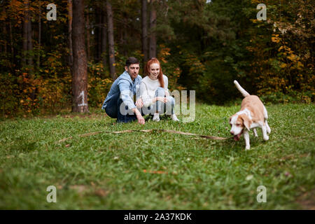 family having great time with their adotrable favorite pet. lifestyle, free time, spare time Stock Photo